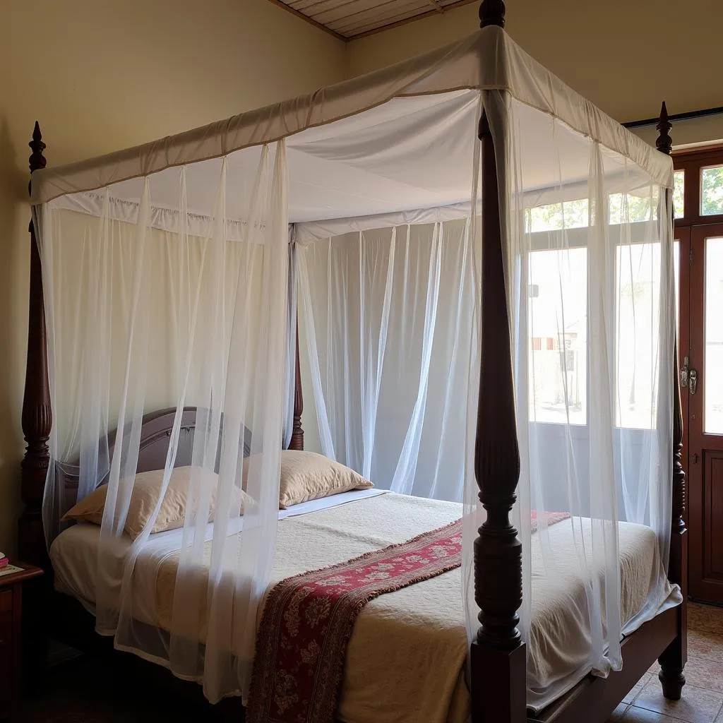 White rectangular mosquito net hanging over a bed