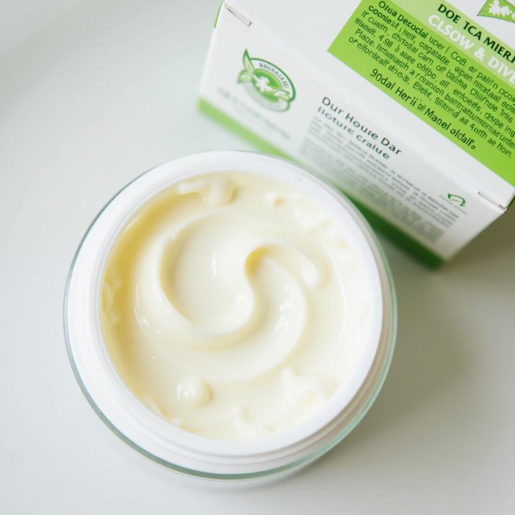 Close-up view of Dermoteen cream packaging and texture