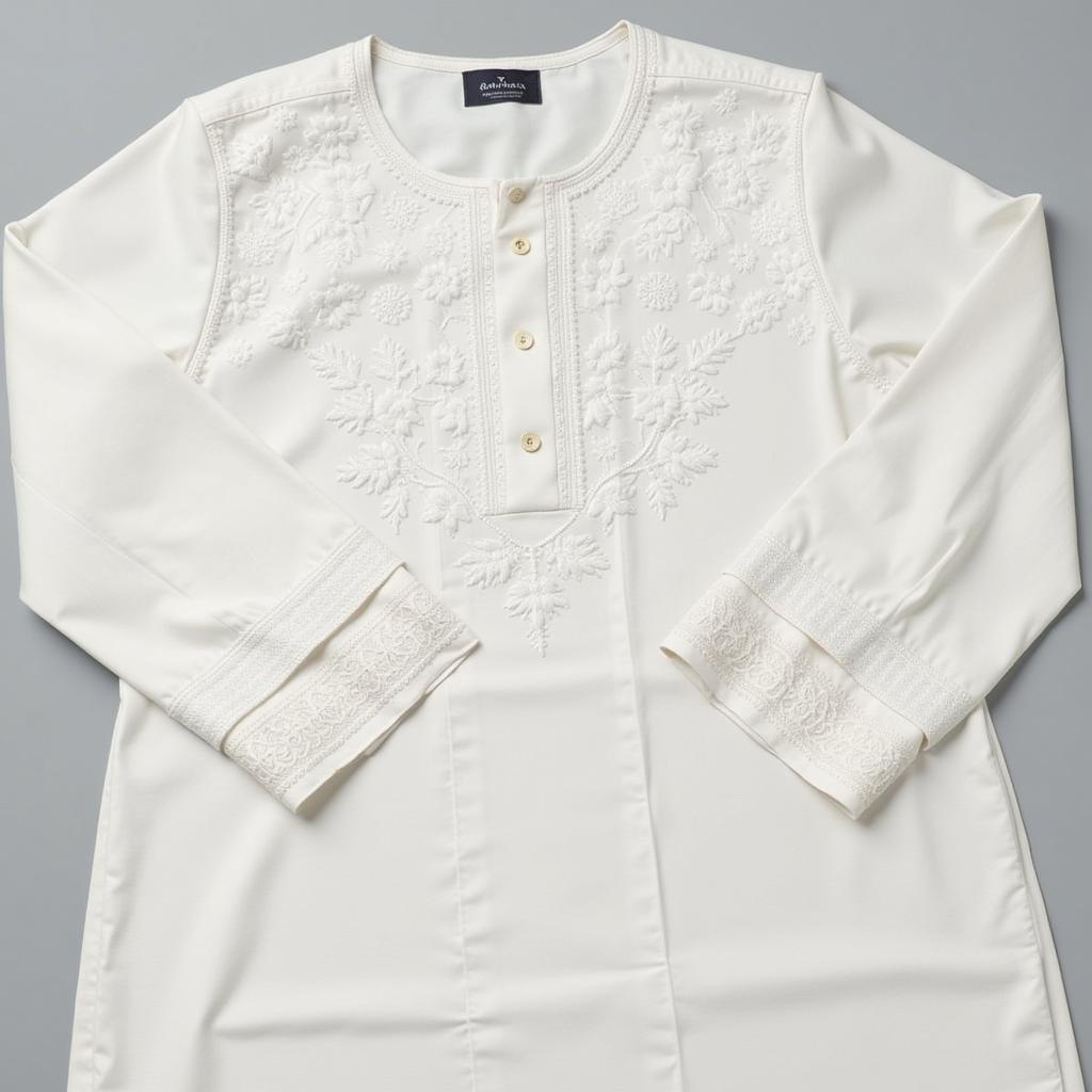 A traditional white chikankari kurta showcasing intricate floral embroidery